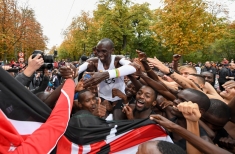 Free for editorial use and archive. Eliud Kipchoge celebrates with his pacemaking team, friends and supporters after crossing finish line to break the historic two hour barrier for a marathon. The INEOS 1:59 Challenge, Vienna, Austria. 12 October 2019. Photo: Thomas Lovelock for The INEOS 1:59 Challenge